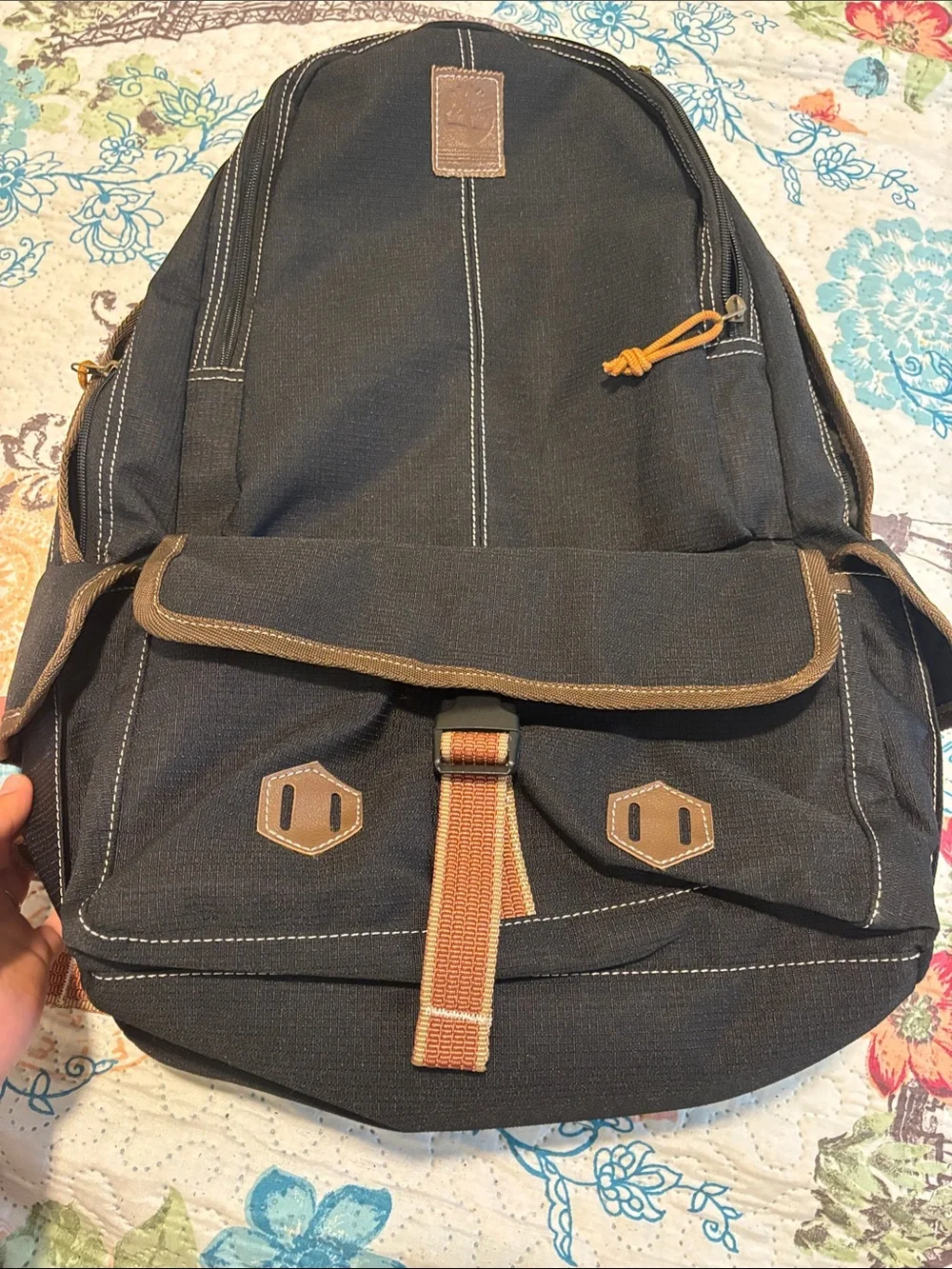 Timberland Black Canvas Backpack with Brown Trim and Orange Pull